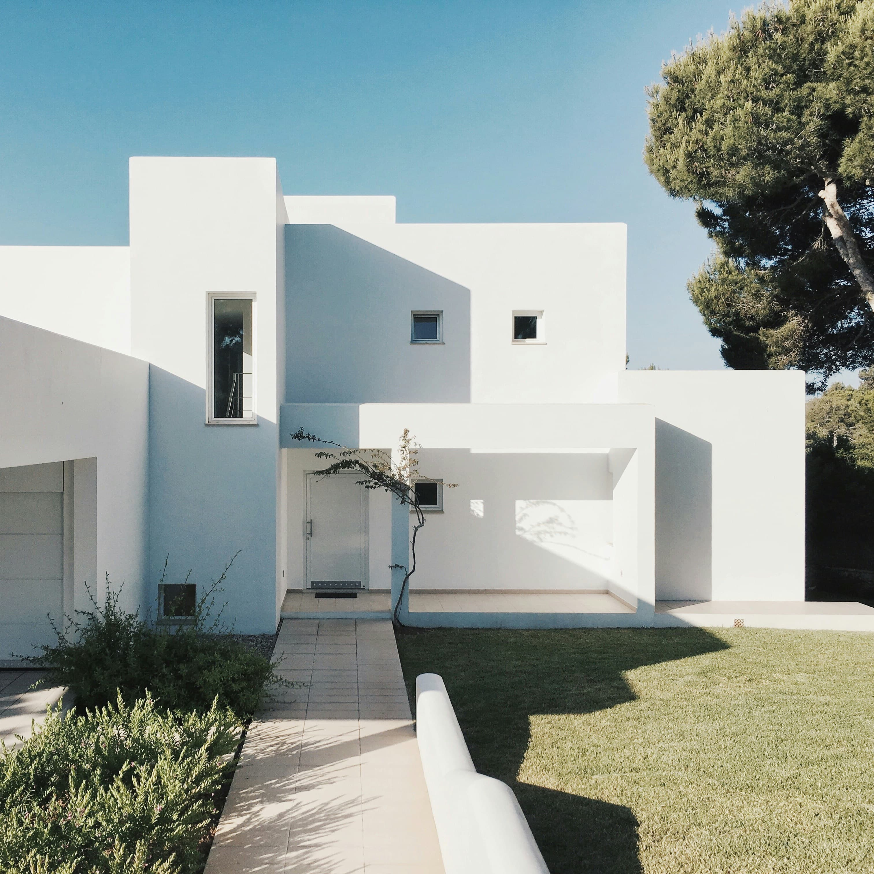 Contemporary detached residential house with a mown front lawn