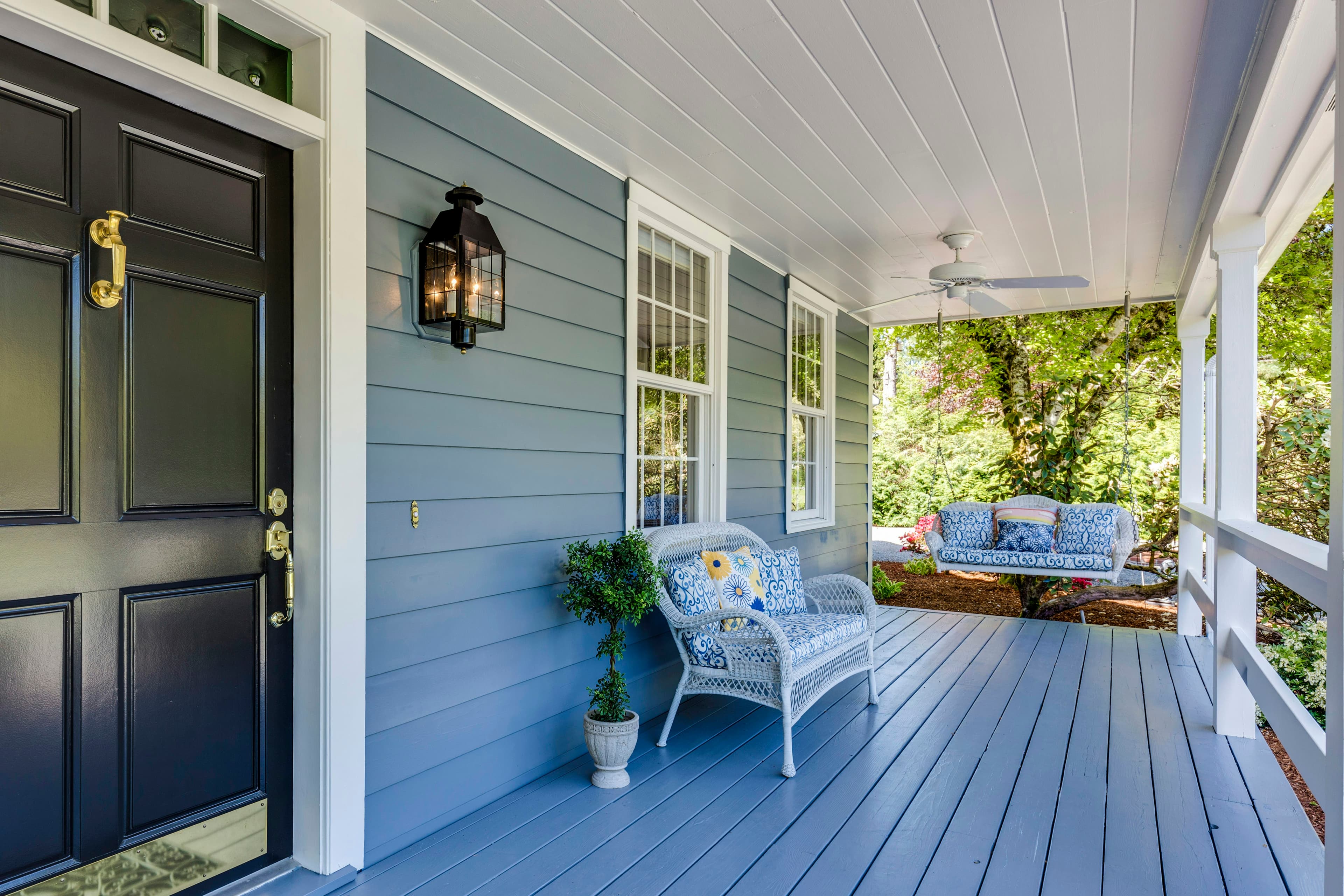 Tidy painted porch and front door of a well-kept house