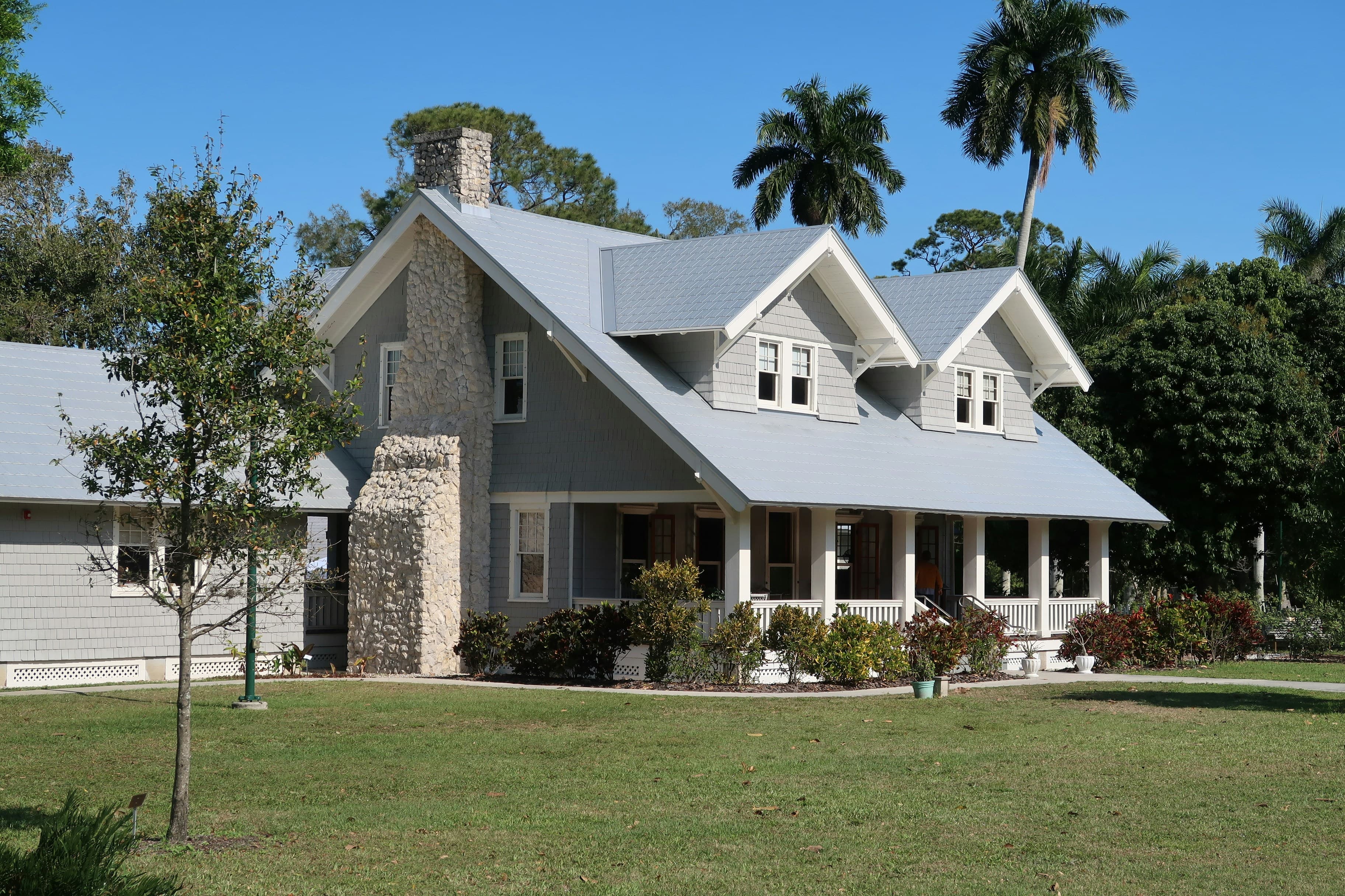 Detached family house with a gabled roof and front lawn