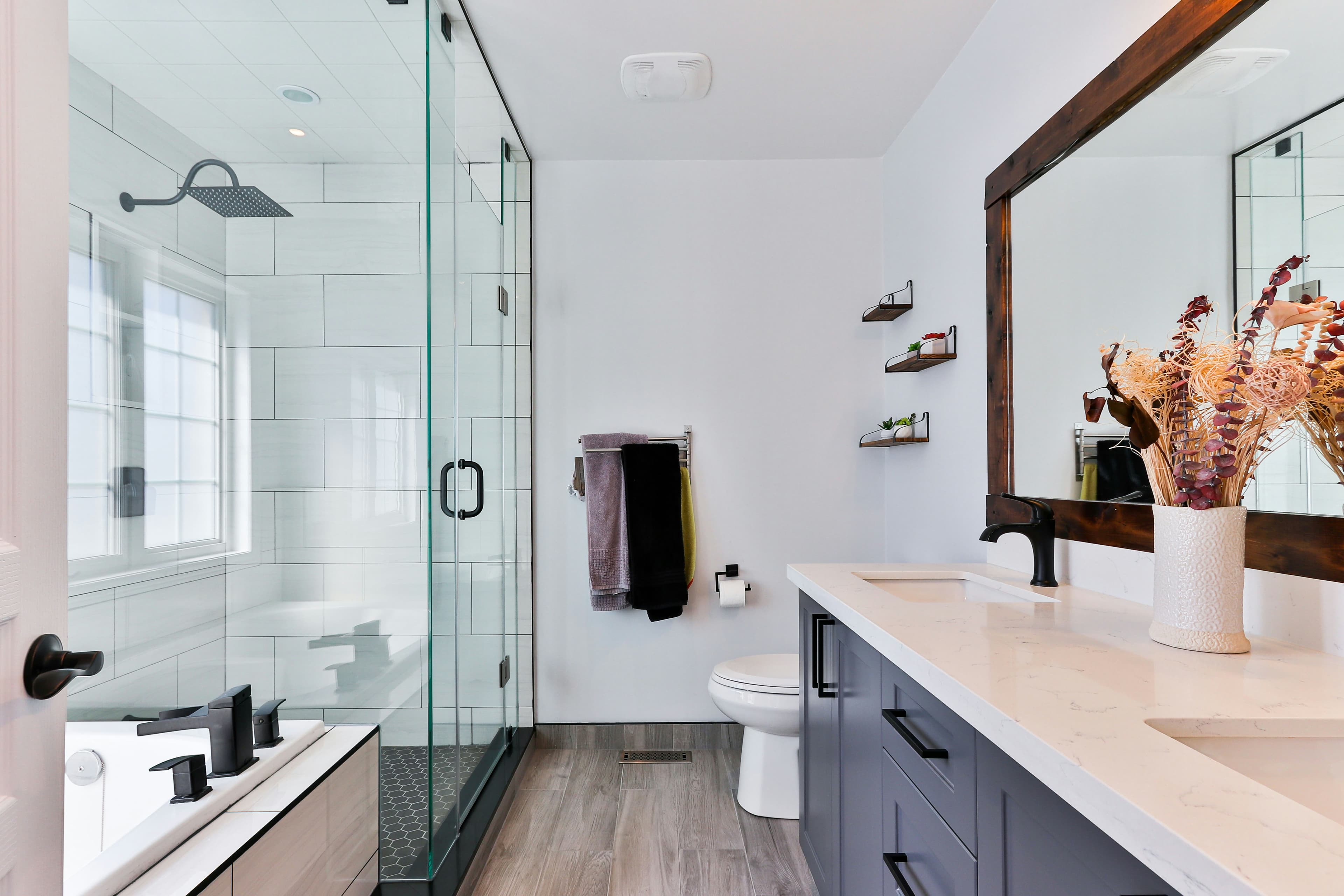 Clean modern bathroom with a walk-in shower and tiled floor